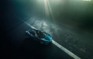 mclaren 720 spyder above left Front three-quarter view of the McLaren 720S Spyder driving through fog, backlit.
