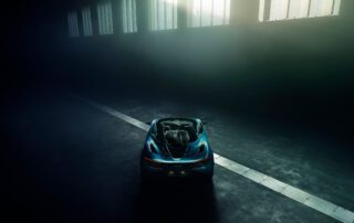 mclaren 720 spyder rear Rear view of the McLaren 720S Spyder driving away down a foggy road.