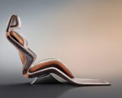 A modern, abstract chair with a sleek, undulating design is shown against a gradient background. The chair features a curvy, layered structure in shades of brown and beige, combining wood and leather elements for a stylish, contemporary look reminiscent of the Bentley EXP GT100 concept.
