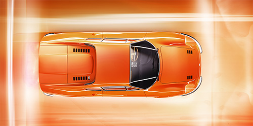 Top-down view of an orange Ferrari Dino against a bright, abstract background. The car features sleek lines, a streamlined design, and a shiny finish, making it a perfect subject for retouchers in London.