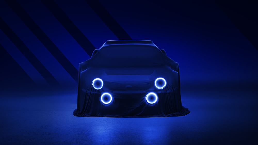 A sleek, covered Ford RS2000 DRVN is dimly lit in a blue hue, with four circular headlights glowing under the fabric. The scene has a futuristic, mysterious ambiance with shadowy streaks in the background, expertly captured by a car retoucher.