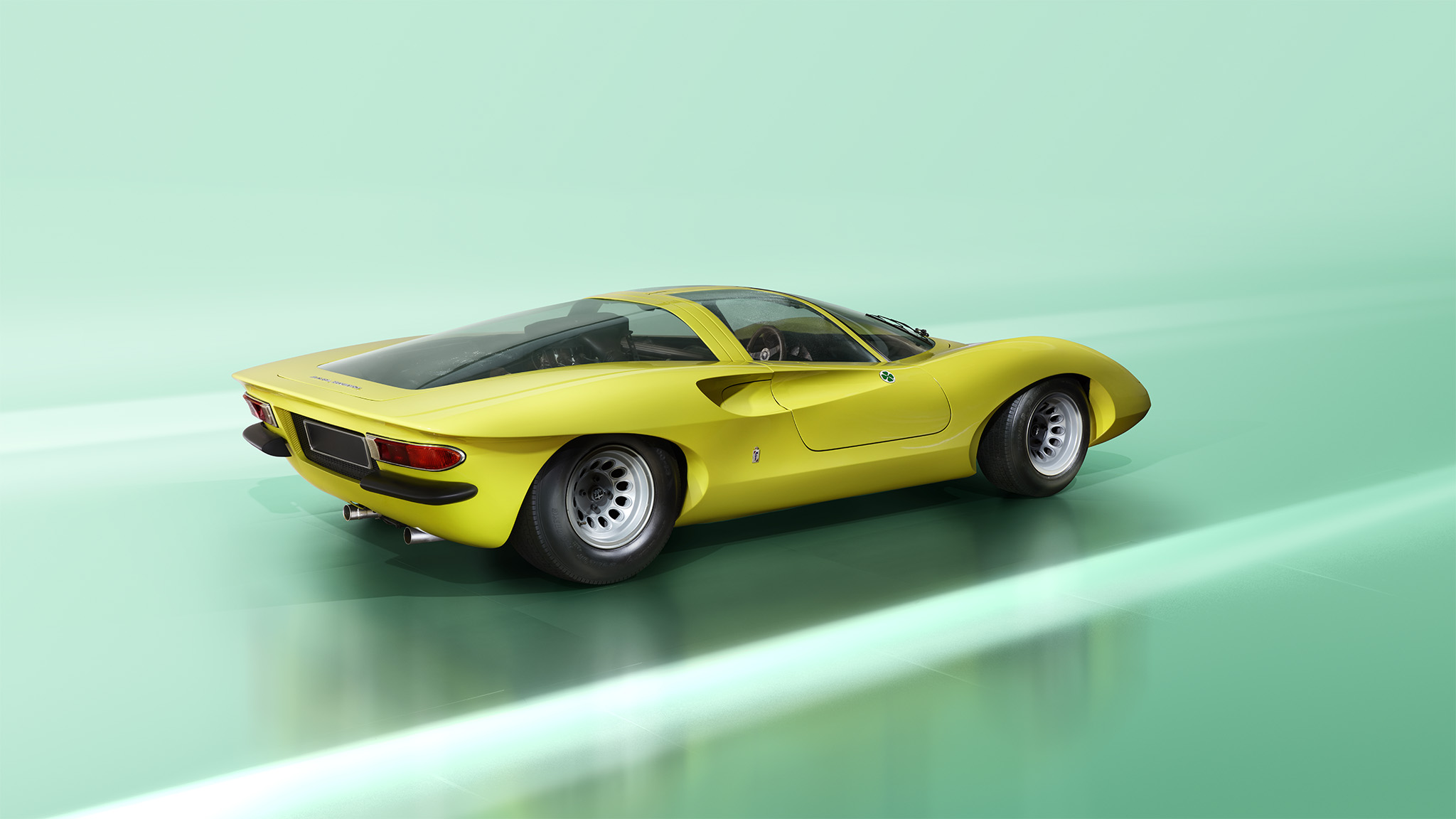 A sleek, yellow Alfa Romeo 33 with a glossy finish is positioned on a smooth, light-green surface. The car features a streamlined design, wide rear tires, and a transparent roof, emphasizing its high-performance aesthetic against a minimalist background—a shot worthy of Magneto magazine's finest retoucher.