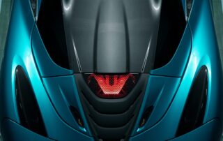 mclaren 720s engine lid Overhead view of the McLaren 720S Spyder, close up showing the light and engine cover.
