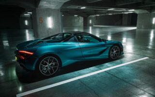 mclaren 720s rear view Rear three-quarter view of the McLaren 720S Spyder among concrete pillars in an underground car park.