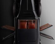 Aerial view of a WO Bentley's 8 litre car. The car doors are open, showcasing the refined interior design. The symmetrical layout emphasizes the sleek lines and classic style of the vehicle, as if meticulously captured by a skilled retoucher.