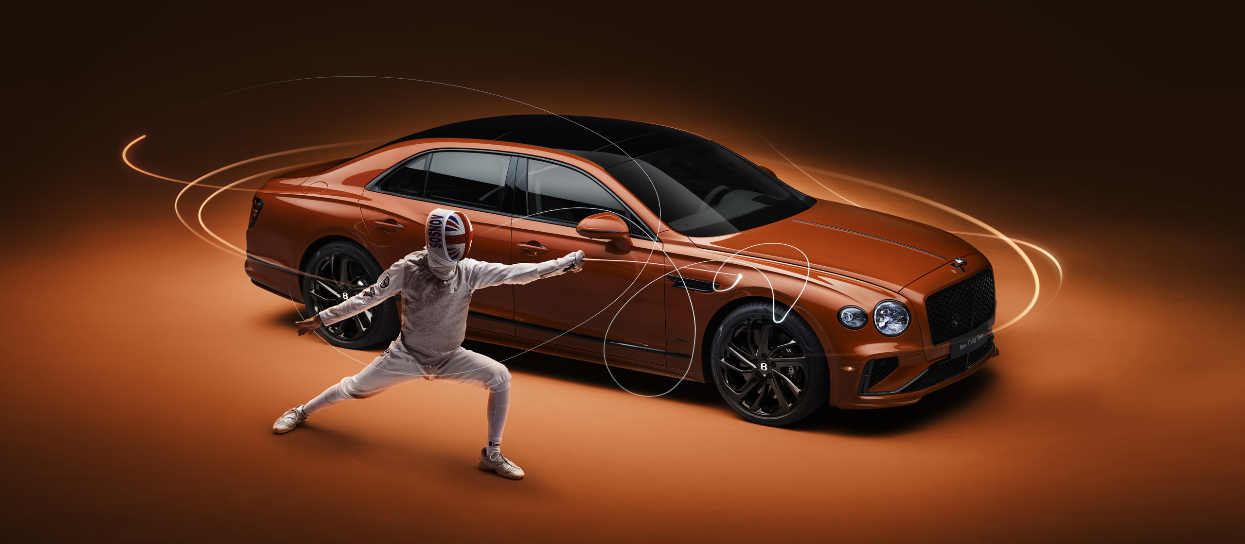 A person in full fencing gear lunges with a sword in front of an orange luxury car, with dynamic light trails swirling around them, set against a matching orange background.