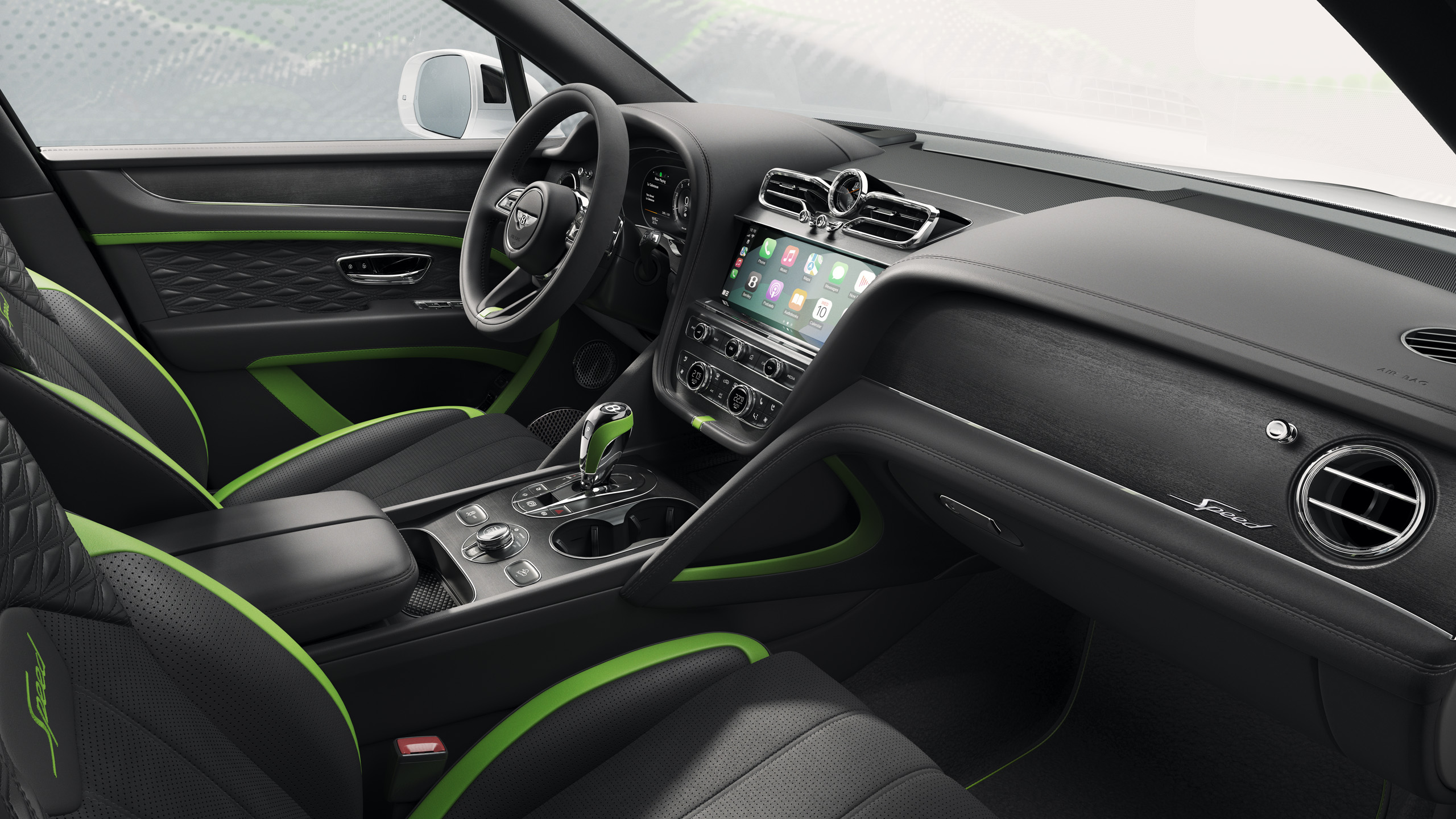 Interior of a luxury car featuring black leather seats with green accents, a modern dashboard with a large touchscreen, green trim details, and a sleek, high-end design.