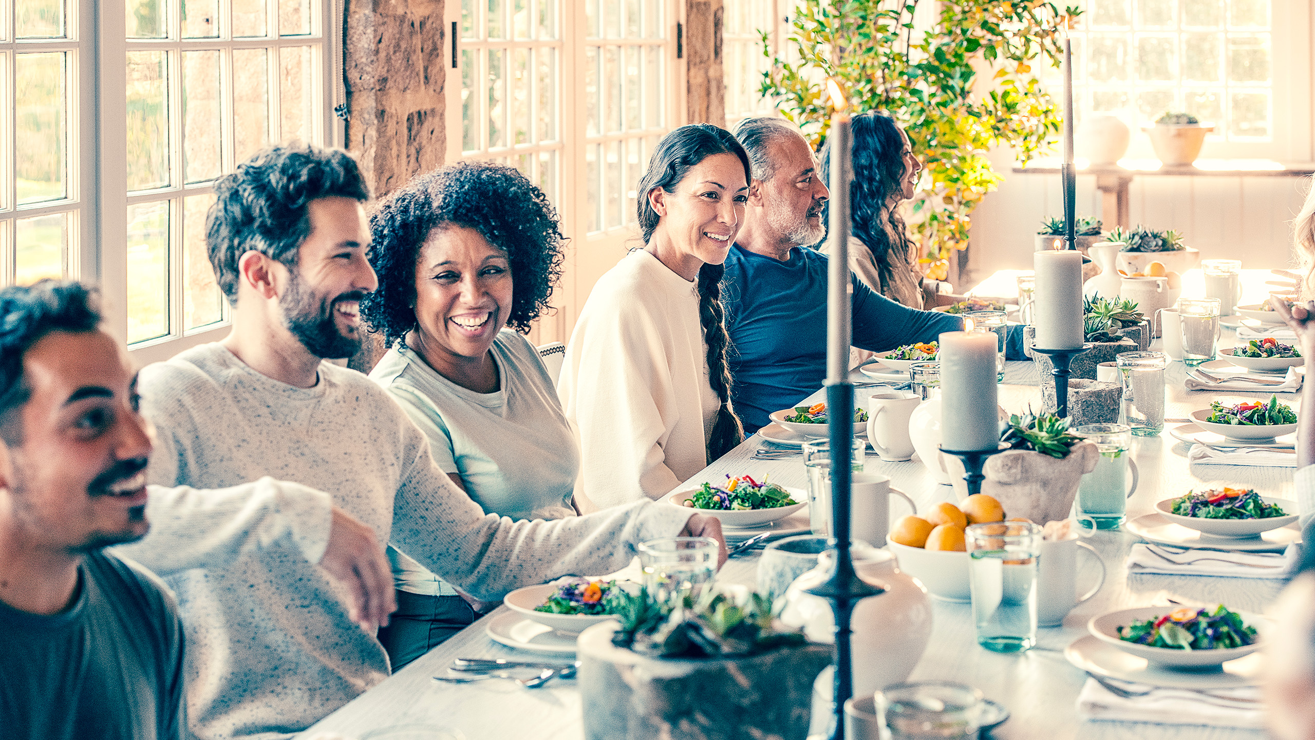 the-ranch-hudson-valley-communal-dining Guests share a communal meal on a sunlit terrace at The Ranch wellness retreat, New York State.