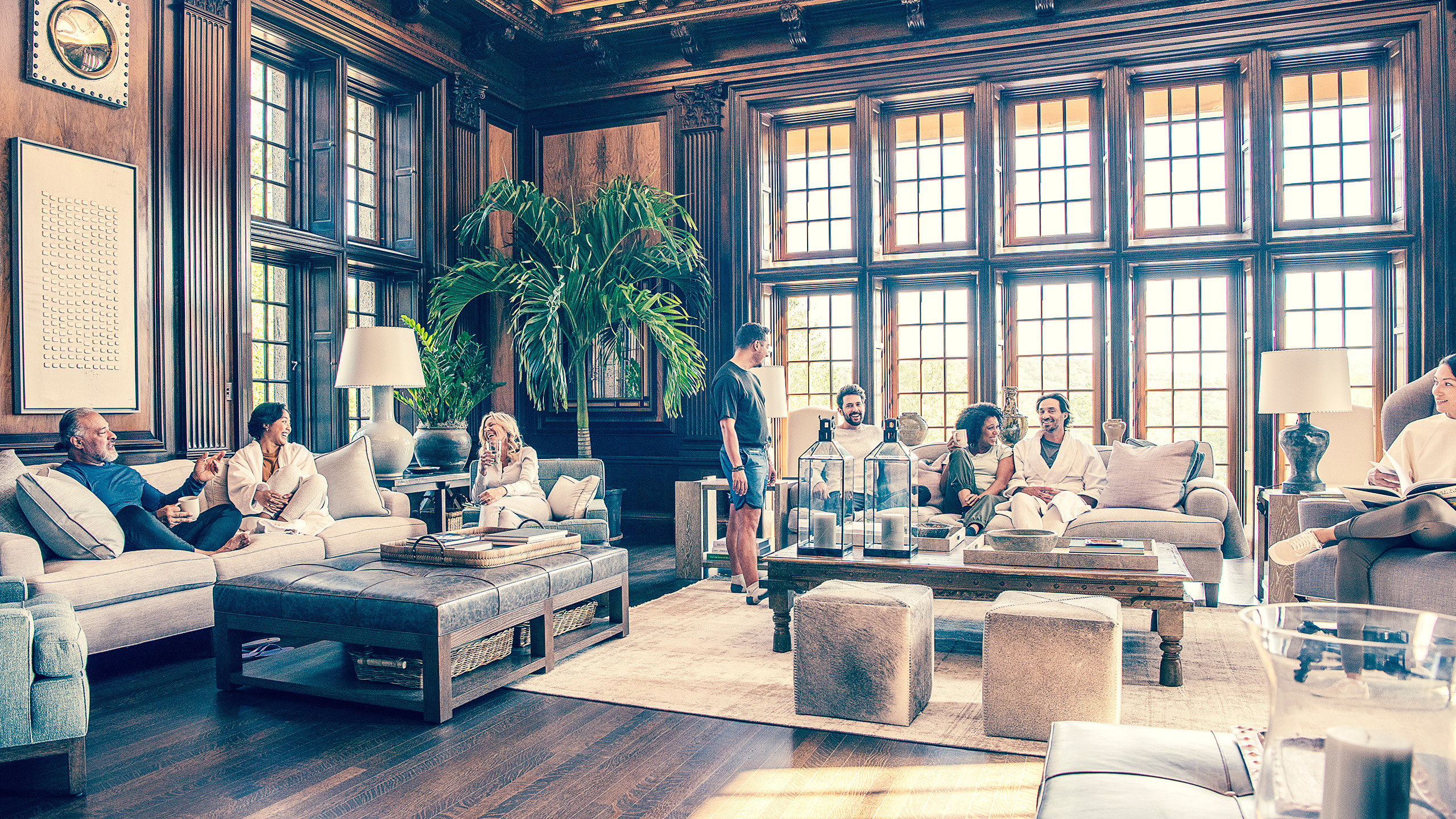 the-ranch-hudson-valley-lounge-relaxing Guests relax together in a wood-panelled lounge at The Ranch wellness retreat, New York State.