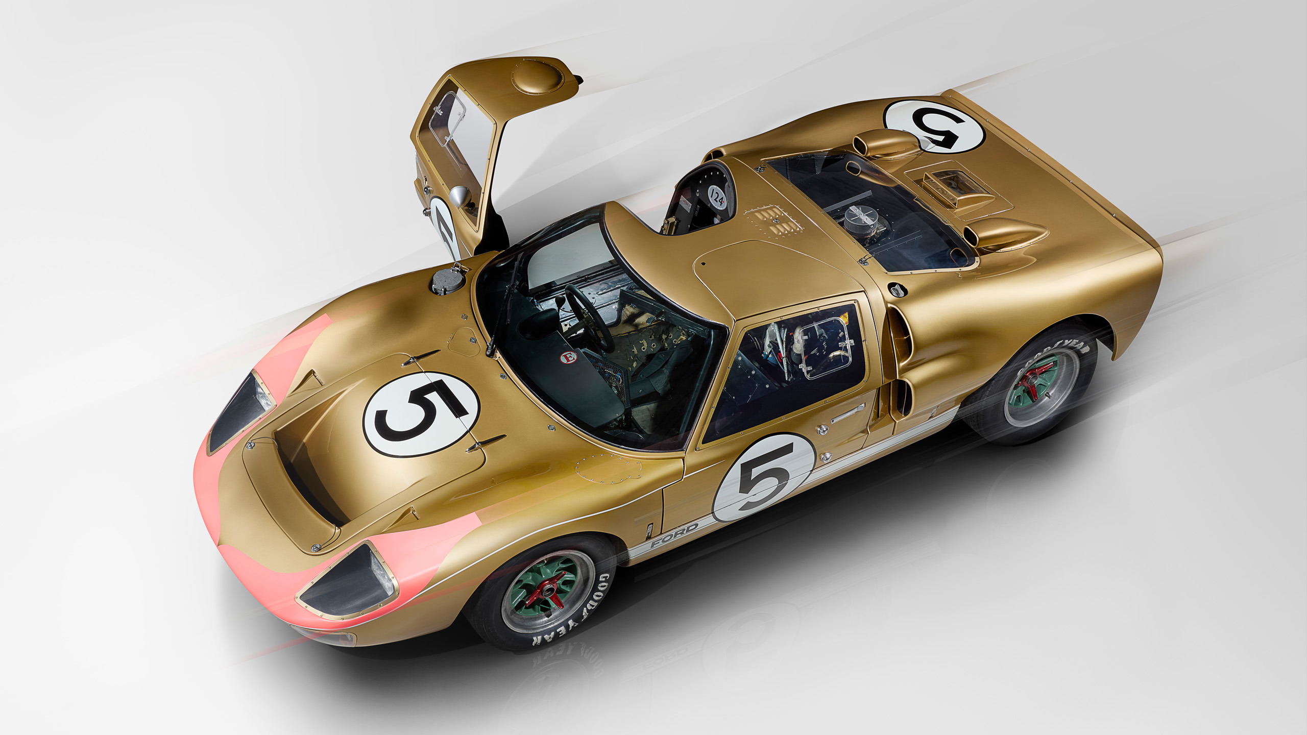 ford-gt40-1966-le-mans-gold-car-5-door-open-overhead_16x9 Overhead view of the gold number 5 Ford GT40 with door open, from the 1966 Le Mans 1-2-3 finish.