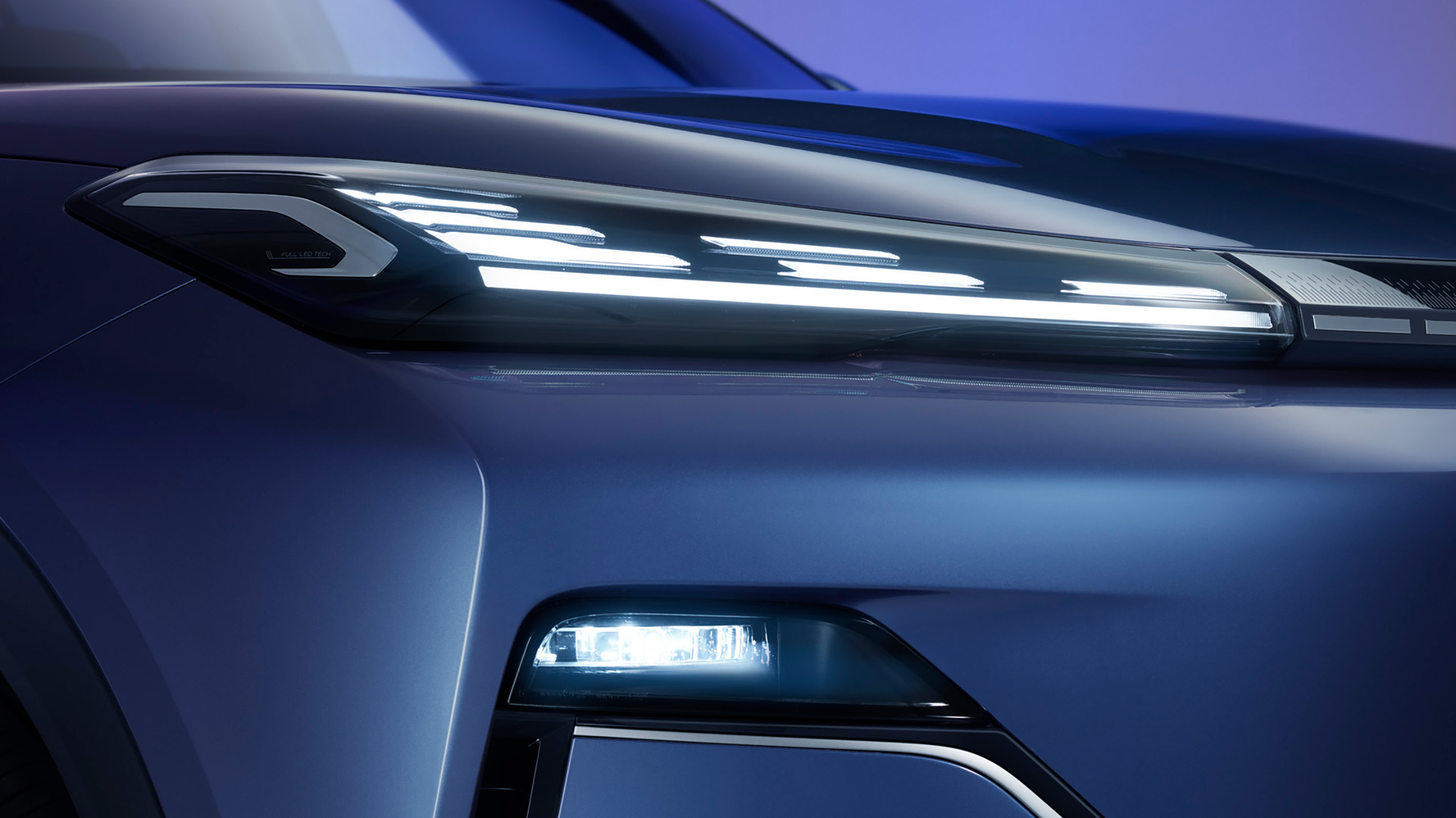 geely-starray-emi-headlight-detail Close-up of the Geely Starray EM-i's full LED headlight and fog light design.