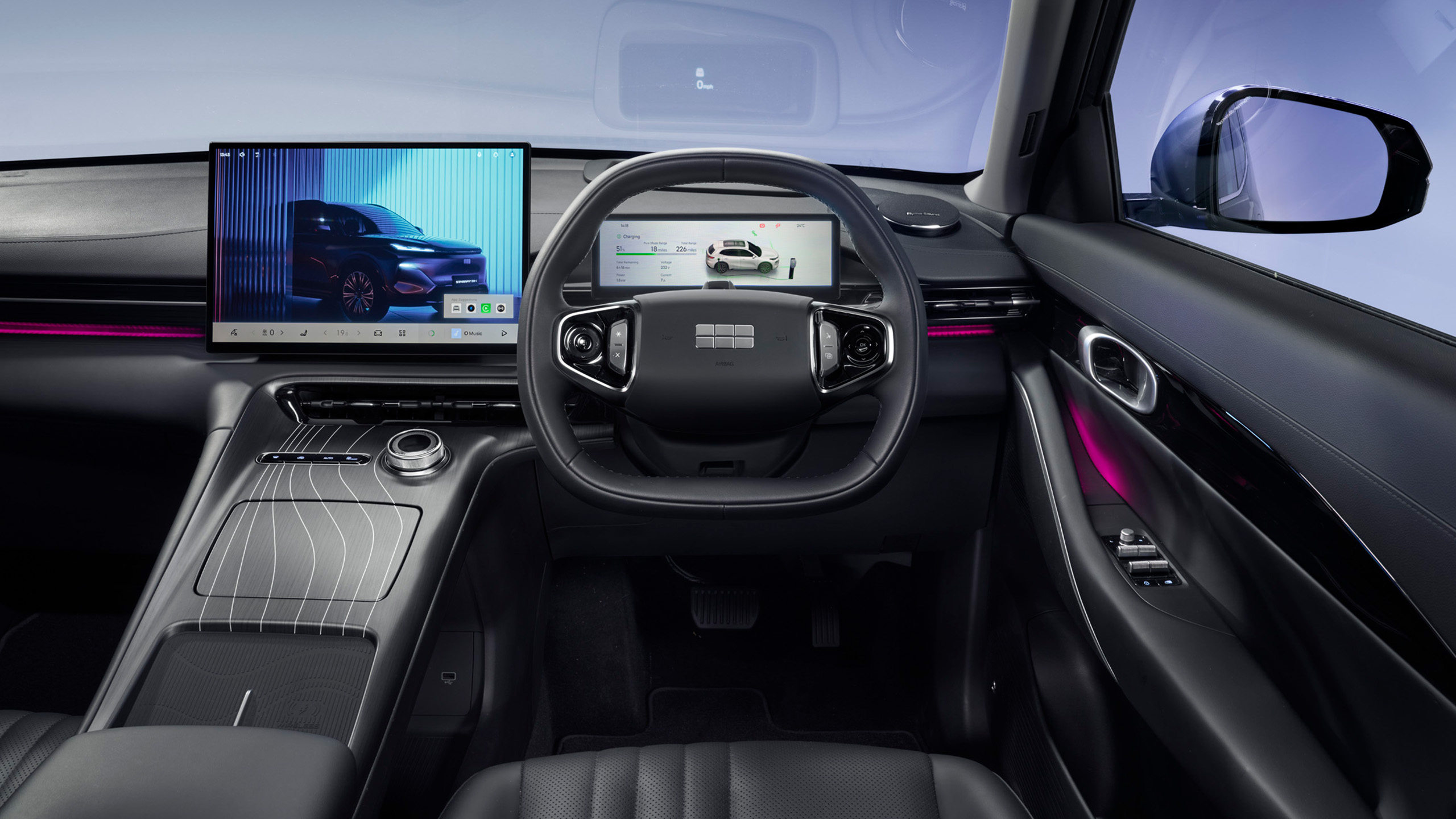 geely-starray-emi-interior-front-dashboard Interior view of the Geely Starray EM-i's dashboard, steering wheel, and dual digital displays.
