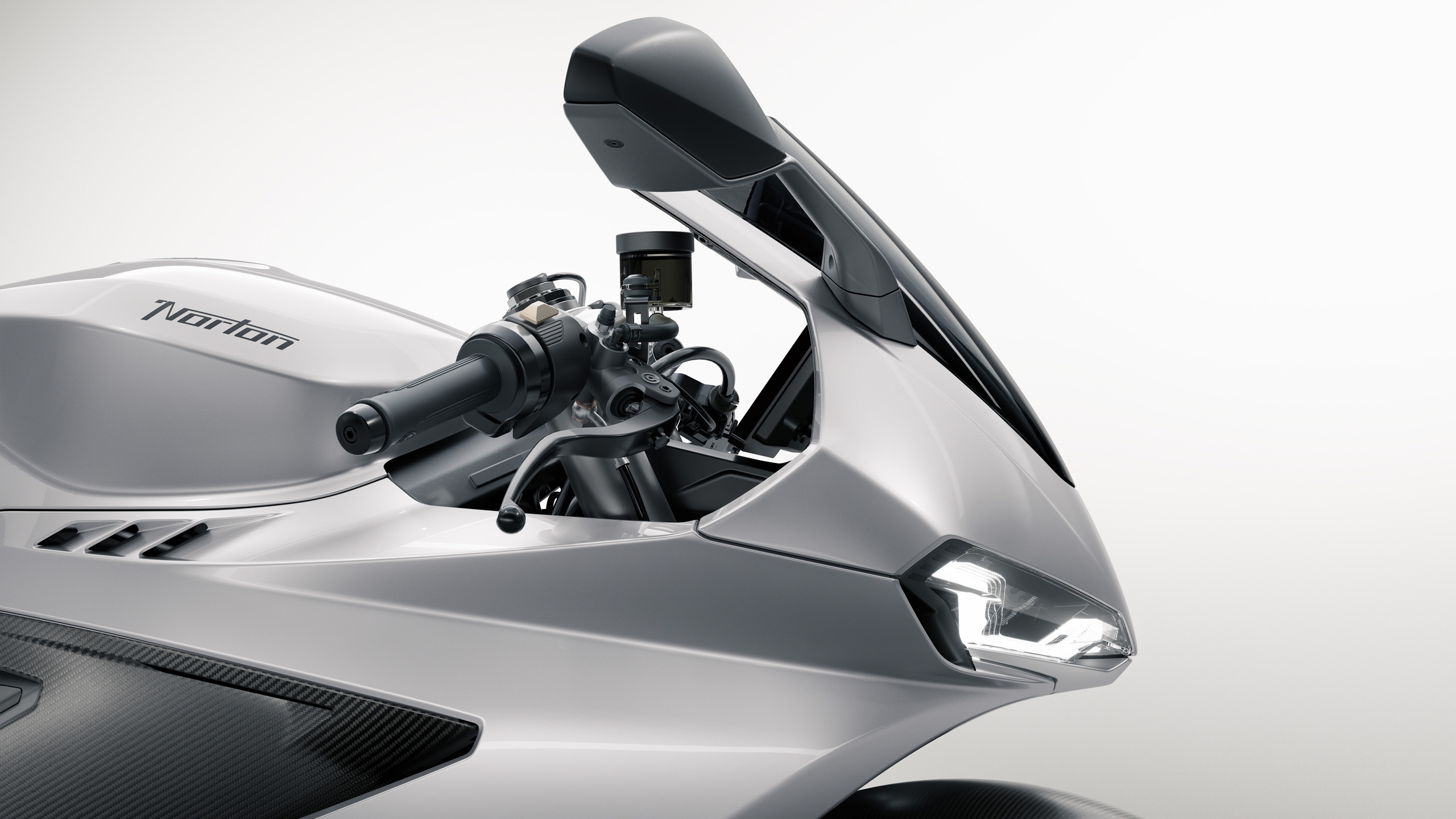 norton-manxr-cgi-cockpit-detail-16×9 Close-up CGI detail of the Norton ManxR's cockpit, showing the windscreen, mirrors, and front headlight.