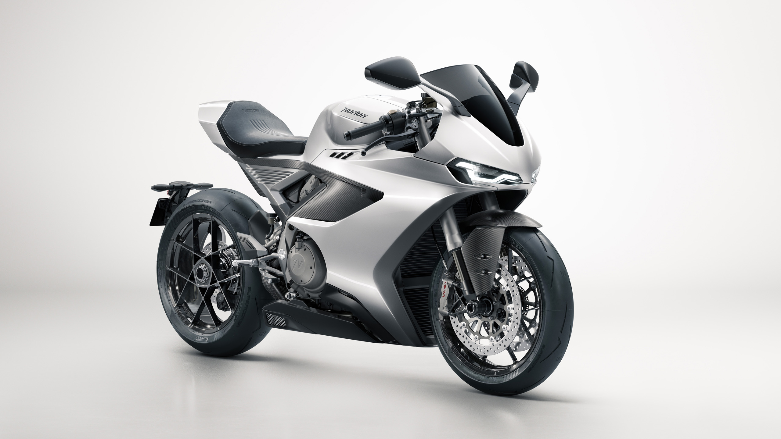 norton-manxr-cgi-front-three-quarter-16×9 CGI render of the silver Norton ManxR motorcycle, front three-quarter view, studio white background.