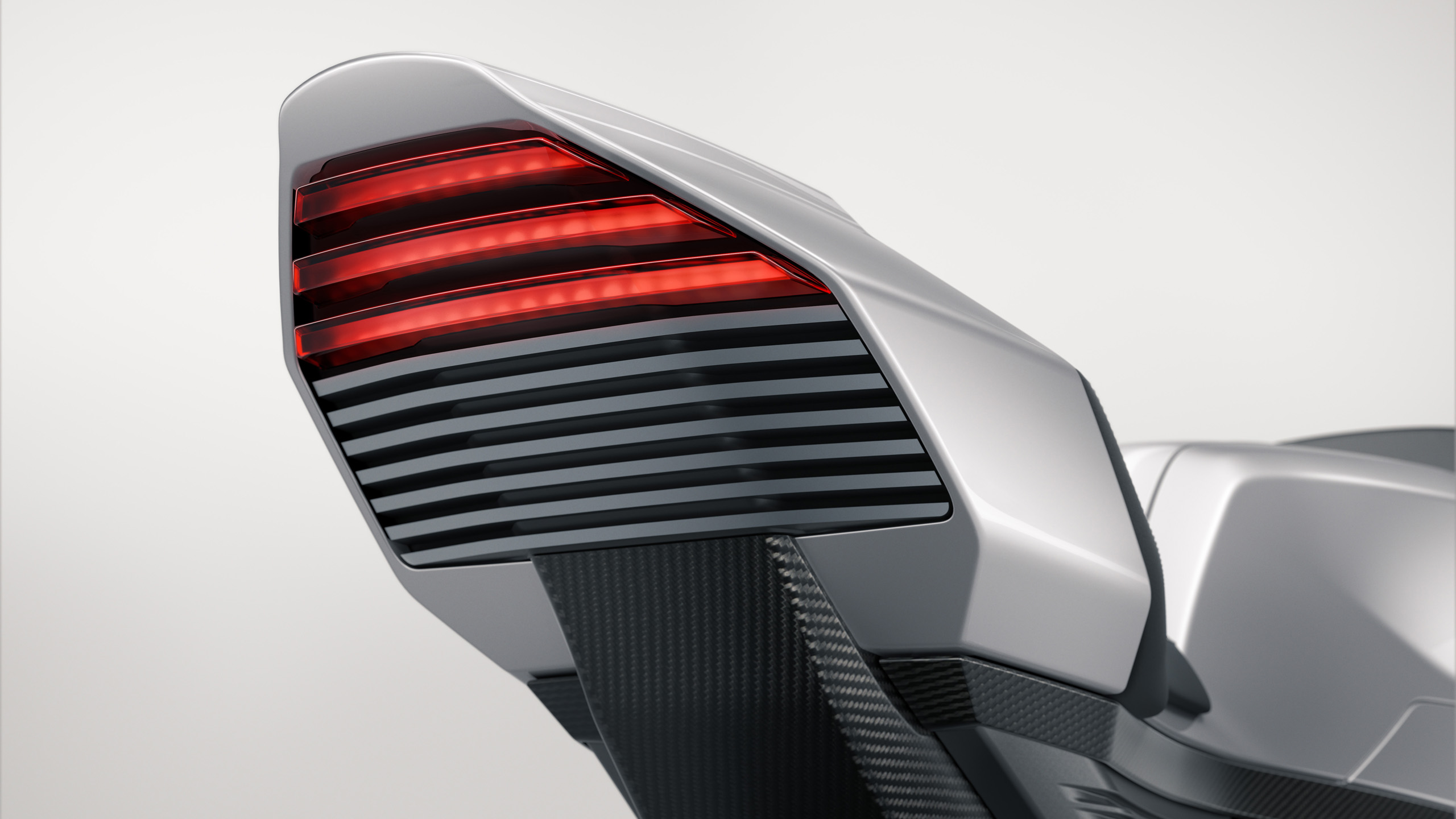 norton-manxr-cgi-tail-light-detail-16×9 Close-up CGI detail of the Norton ManxR's illuminated LED tail light and carbon fibre tail section.