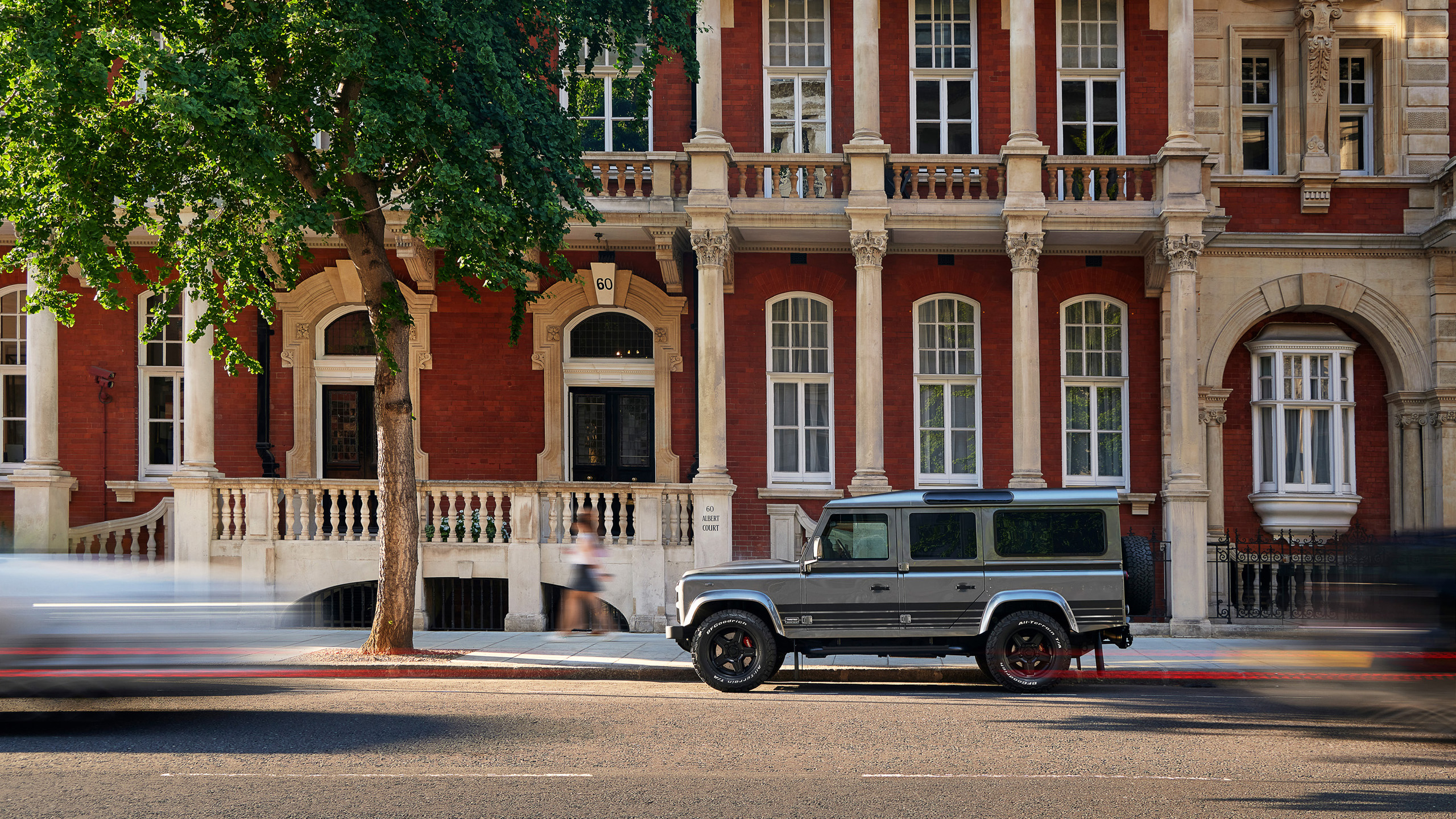 twisted-land-rover-defender-110-royal-albert-hall A gunmetal Twisted Land Rover Defender 110 parked outside a red-brick townhouse near the Royal Albert Hall, London.