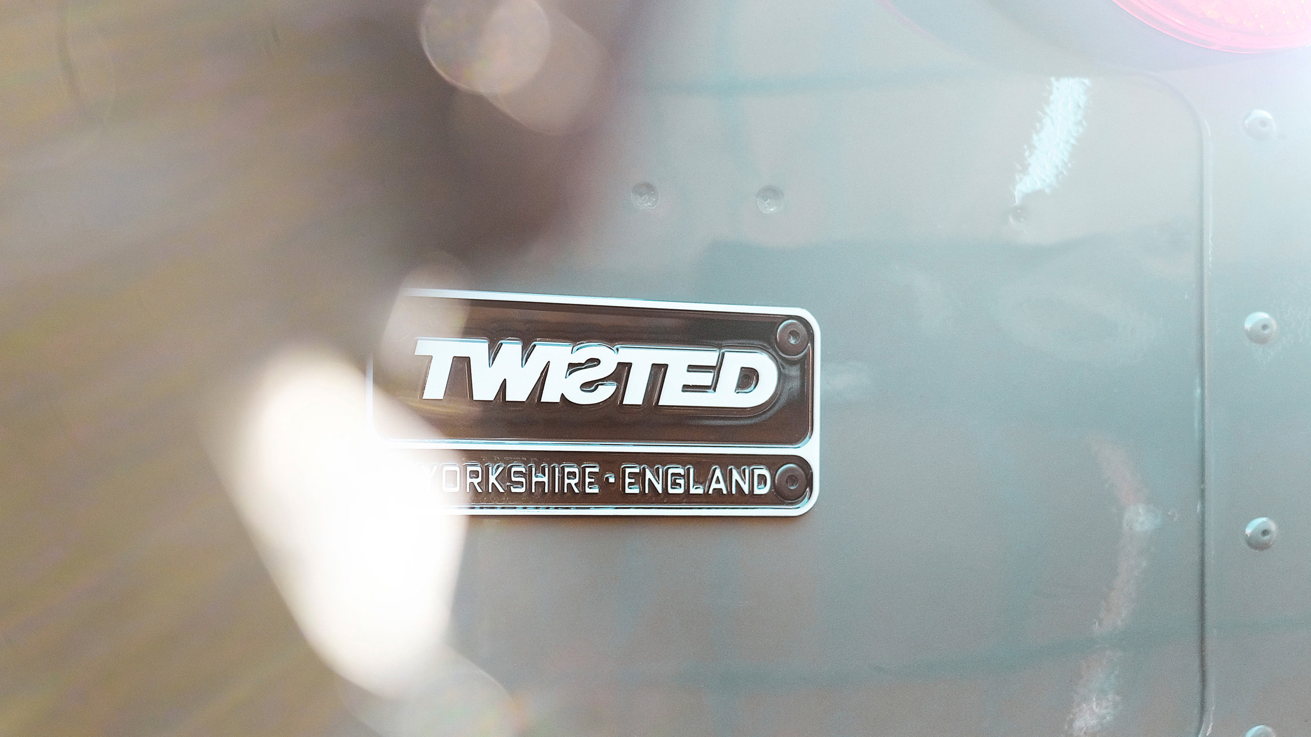 twisted-land-rover-defender-badge-detail Close-up of the Twisted badge reading "Yorkshire, England" on the bodywork of a Land Rover Defender.